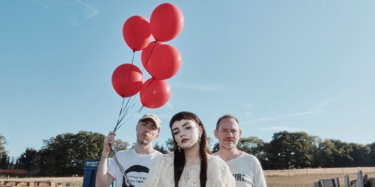 The three members of CHVRCHES in a 2026 promotional photograph
