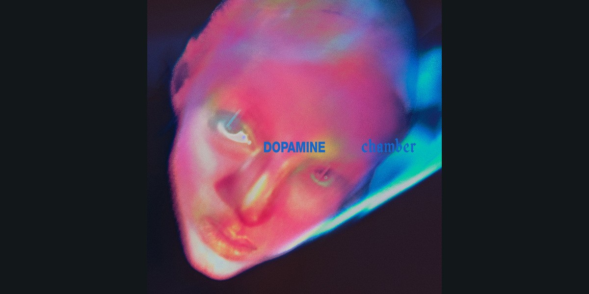 Official Dopamine Chamber cover showing a face in pink, blue and yellow light.